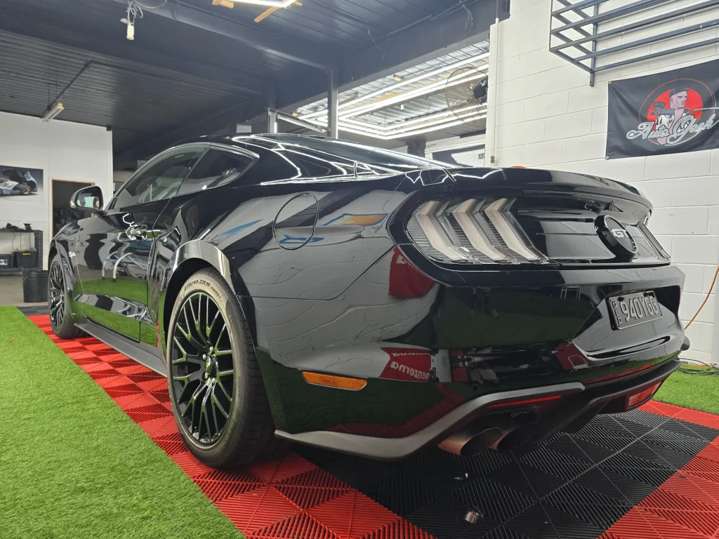 Black Ford Mustang GT with a deep gloss finish after ceramic coating