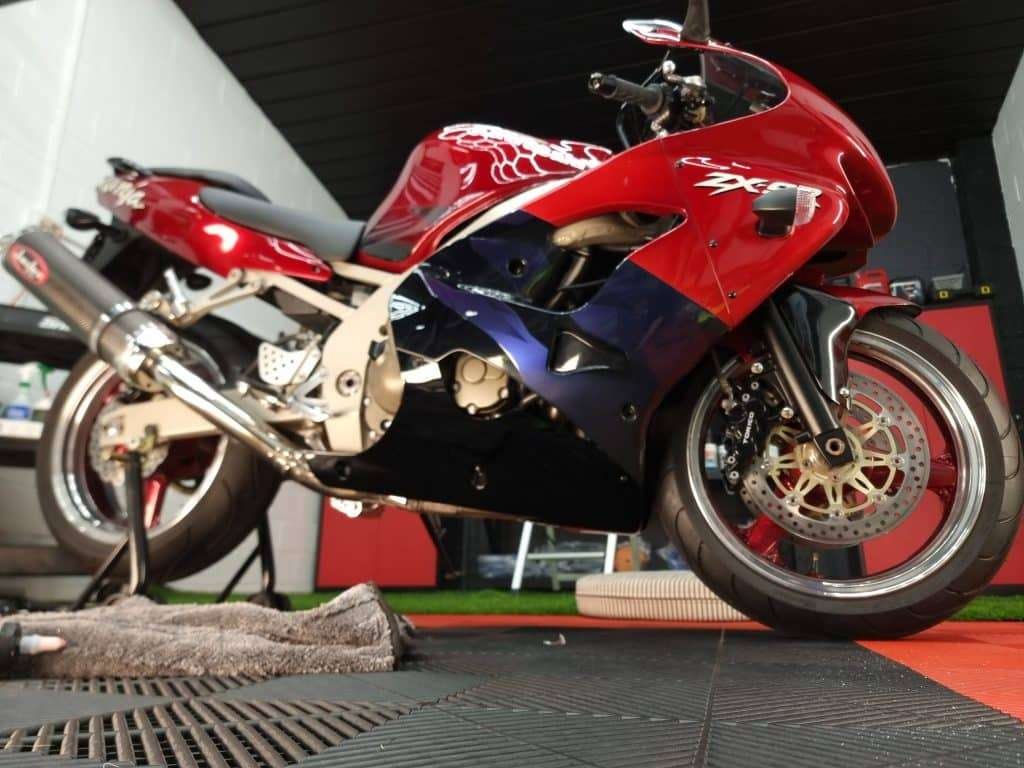 Red sports motorcycle after a detail and gloss enhancement