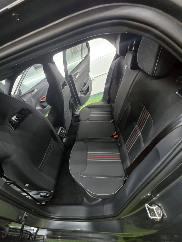 Cleaned black leather rear seats after an interior detail