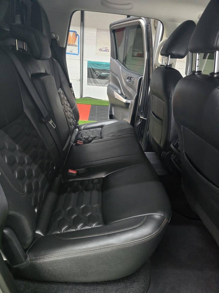 Diamond-stitched leather rear seats after interior cleaning