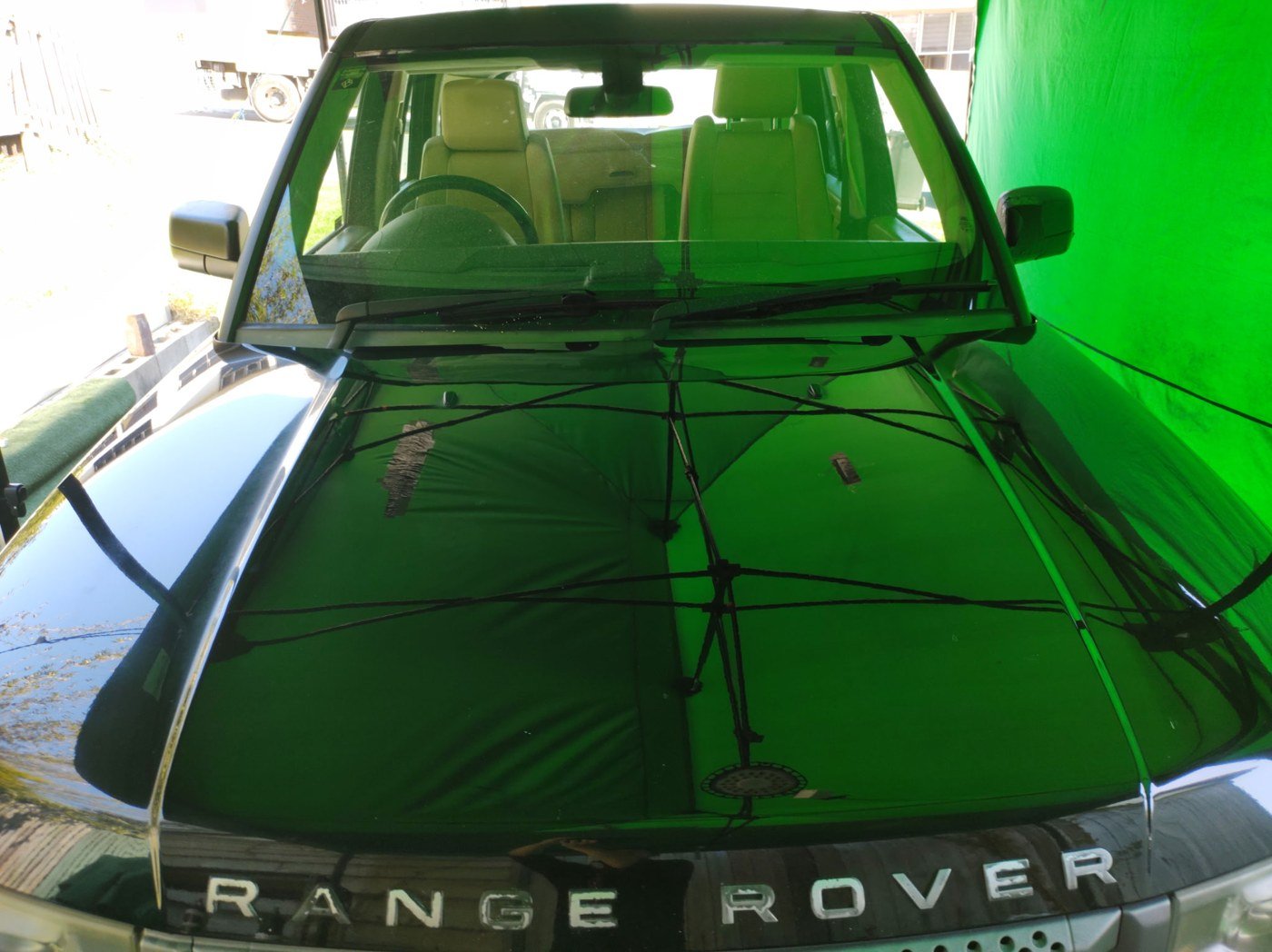 Range Rover bonnet with visible hard water staining and calcium deposits before treatment